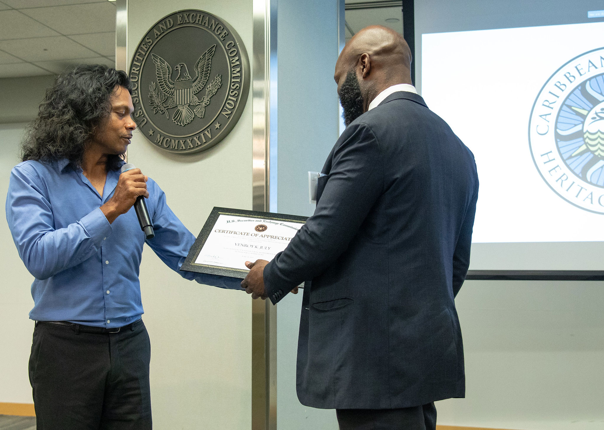 Caribbean American Month Speaker accepting certificate 